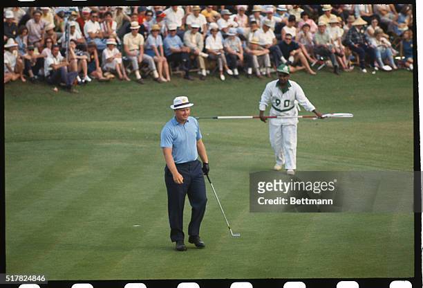 Augusta, Ga.: Jack Nicklaus walks from the 18th Green after sinking putt on the 3rd round of the Masters Tournament which gave him a 64 the day. This...