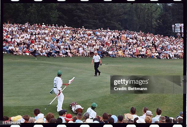 Augusta, Ga.: Jack Nicklaus smiles confidently as he walks onto the 18th green to sink his final putt in the last round of the Masters Tournament...