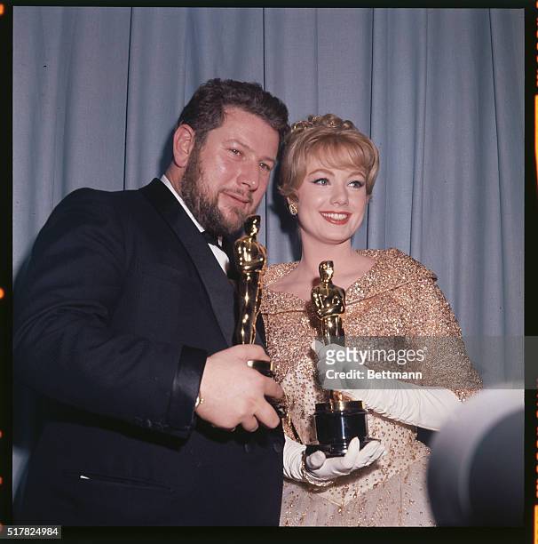 Annual Academy Awards: Winners of oscar for best actress and actor in a supporting role, Peter Ustinov and Shirley Jones hold oscars.
