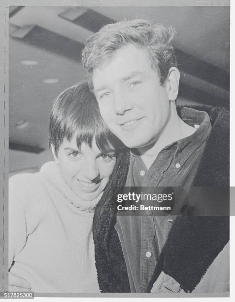 Attractive Duo. Manchester, Lancs, England: Songstress Liza Minnelli, daughter of Judy Garland, hugs actor Albert Finney as he welcomes her upon...