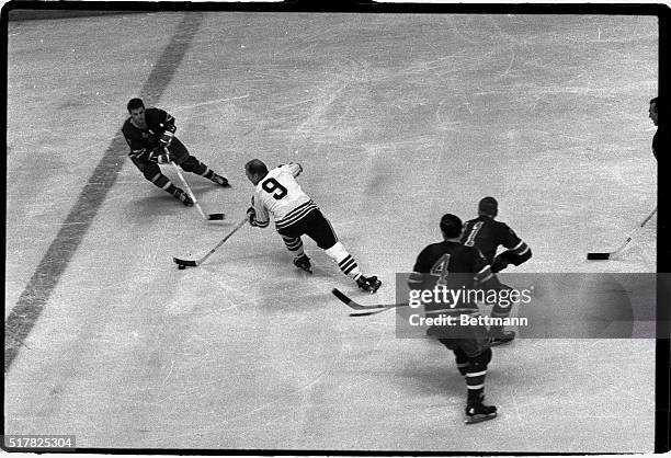 Bobby Hull of the Chicago Black Hawks, and Rod Gilbert , New York Rangers, is shown in action, November 26, 1966.