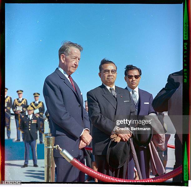 Laotian Prime Minister Souvanna Phouma photographed following his arrival, October 12th. Left to right are : Llewellyn Thompson, U.S. Ambassador...