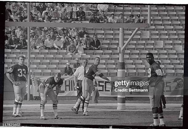 Green Bay's Bart Starr lets go with a practice pass under the watchful eye of Green Bay Coach Vince Lombardi as the team works out before the start...