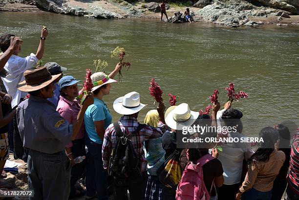 People honor the late assassinated environmentalist Berta Cáceres with a religious ceremony on the Gualcarque River, Santa Barbara department, 200...
