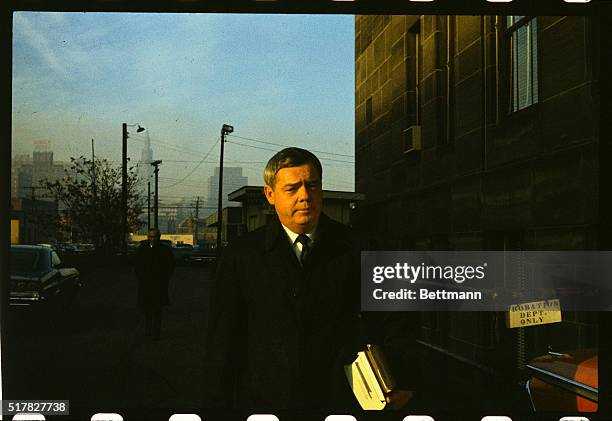 Francis Talty presiding judge of the Dr. Sam Sheppard retrial walks outside the Cuyahoga County Criminal Court Building. Sheppard is accused of the...