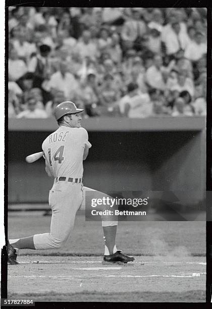 Cincinnati Reds' Pete Rose takes a powerful swing against St. Louis Cardinals' pitcher Larry Jaster in 6/14 game. Rose is leading the National League...