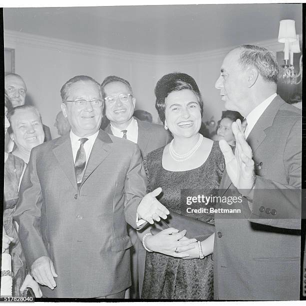 Yugoslavia's Marshal Tito extends his hand as he and his wife, , are greeted on their arrival at a reception at the Waldorf Astoria, Oct. 24th., by...