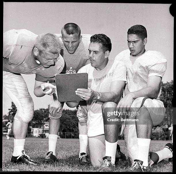 College All-Stars coach Otto Graham has a little skull drill with his quarterbacks during workout here 8/1. Problem for Graham, and his three...