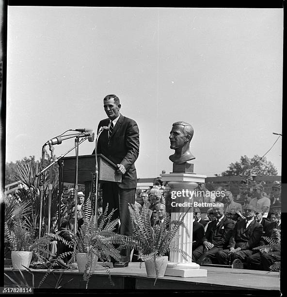 Photo from the professional football Hall of Fame dedication ceremonies shows Sammy Baugh making a speech and accepting a bust.