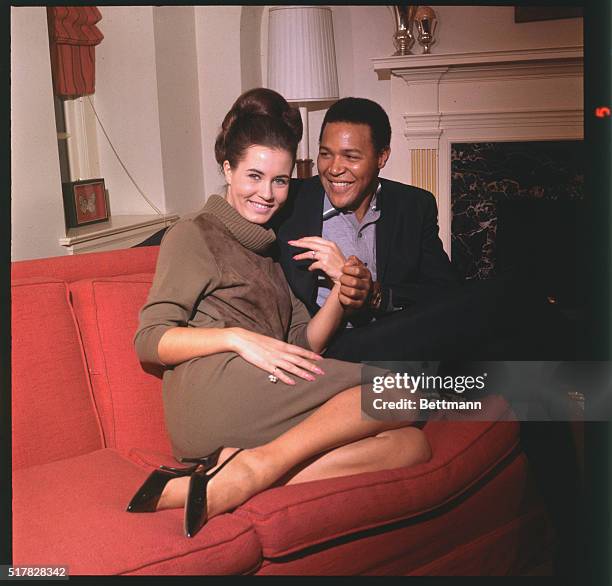 Twist idol Chubby Checker and his bride-to-be, Catharina Lodders of Haarlem, Holland, who was Miss World of 1963, kiss after the 22-year-old...