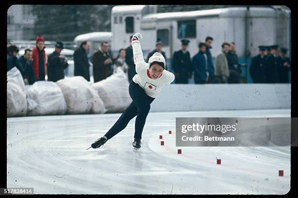 Japan, Tokyo: edith McGuire running in the Women's 200 meter race which she won.