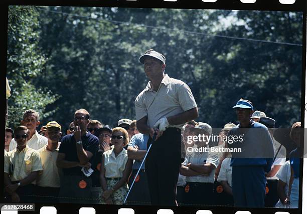 Harrison, N.Y.: Arnold Palmer waits and then tees off on 15th tee during first round of play, July 29, in Thunderbird Golf Tourney at Westchester...