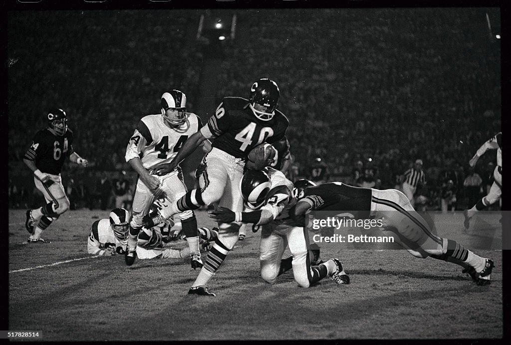 Gale Sayers Gets Hit Carrying Football