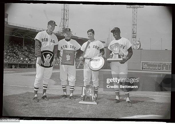 Members of the Boston Red Sox hold their awards that were presented to them prior to their opener with Detroit at Fenway Park 4/16. L-R Jim Lonborg,...