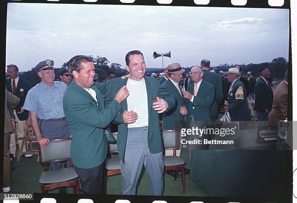 Augusta, GA: Gay Brewer, golfer with Bob Goalby as he presents the latter with a Green Coat as this year's Master's winner. Brewer won in 1967.
