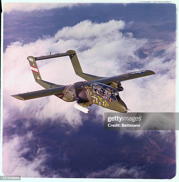 Countersurgery reconnaisance aircraft in flight. The twin eingine craft is a two place tandem.