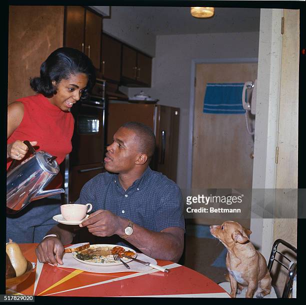 S overwhelming choice for NFL Rookie of the Year, Chicago Bear's Gale Sayers relaxes at home. Sayers won scoring honors with 22 touchdowns as he...
