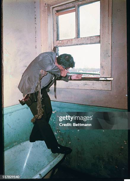 Memphis, Tennessee: This the interior of the communal bath from which it is believed the fatal bullet was fired at Dr. Martin Luther King. Here a man...