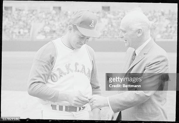 Oakland: Jim Hunter got his reward for pitching the first perfect game in American League in 46 years against Minnesota, from A's owner Charles O....