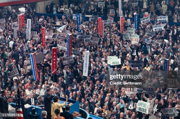 Chicago: Sen Edmund S. Muskie, Maine along with his wife, Jane, stand before Democratic Convention after he accepted vice presidential nomination....