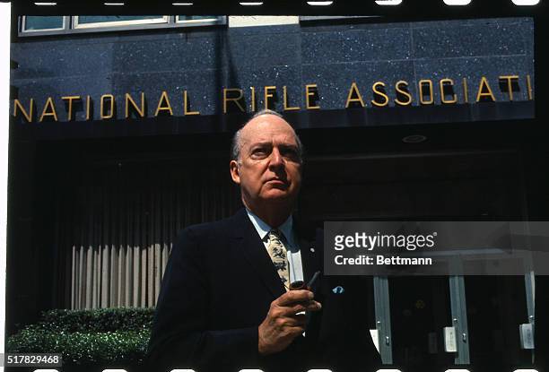 Harold W. Glassen, President of the National Rifle Association is shown here in front of the association's headquarters.