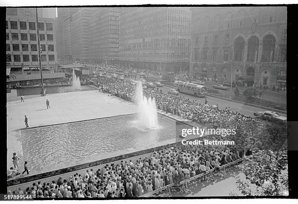 People are shown in a line extending from E. 53rd Street and south along Park Avenue, waiting to view casket of Robert F. Kennedy lying in state in...