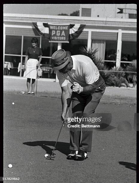 Sam Snead, looking more like a croquet player with his new putting prior to playing a round over the Pecan Valley Country Club course, where the 50th...