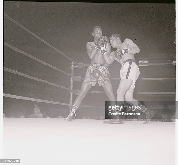 Manhattan, New York, New York: Former lightweight champion Ismael Laguna of Panama, and Victor Melendez of Puerto Rico mix it up during their...