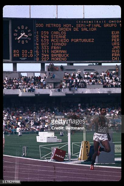 Mexico City, Mexico: USA's John Carlos is shown is action during the last heat of the men's 200 meter dash which he won in 20.5 sec.
