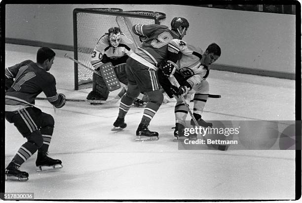 Bobby Orr, #4 of the Boston Bruins, breaks a drive on goal.