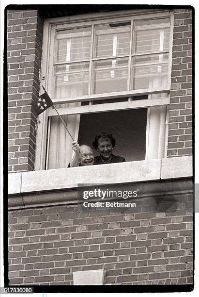 Washington, DC- Former President Dwight D. Eisenhower waves a five-star flag from the window of his room at Walter Reed Medical Center on October...