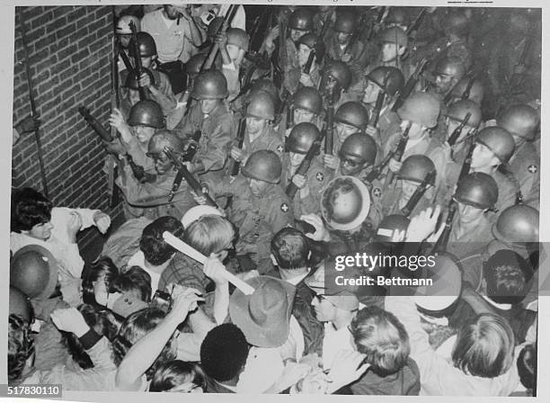 Demonstrators meet head on with a solid wall of National Guardsmen in an attempt to break out of their confinement in Grant Park here August 29th....