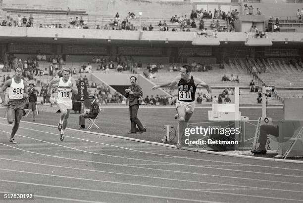 The U.S.A.'s Bill Toomey wins the 100-meter third heat, an event in the men's Decathlon, the most grueling of all Olympic events. Austria's Horst...