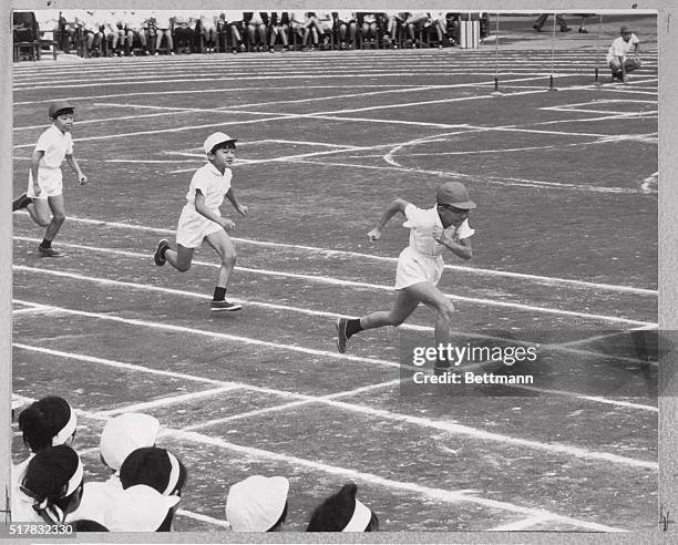 An Athletic Prince. Tokyo, Japan: Prince Hiro tries hard to overtake the young fellow in front of him during the 70-meter race of the Autumn Athletic...