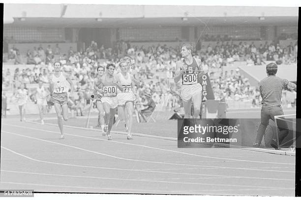 Mexico City, Mexico: Jim Ryun of Wichita, Ks., seems to be looking back to see what happened to everybody else as he wins his qualifying heat in the...