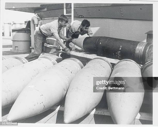 Influence In The Pacific. Aboard the USS New Jersey: SN Steven Senft, of York, Pa., and SN Roy Mankowski of Watoma, Wisconsin, move a 16-inch shell...