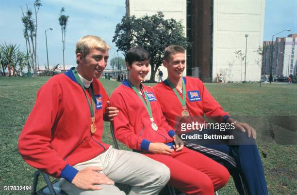 Mexico City, Mexico: British Olympic team medal winners L-R: Dave Hemery, gold for 1st place in 400 meter hurdles; Mrs. Sheila Sherwood, silver for...