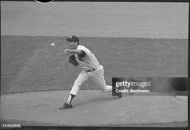 New York: In action against the Seattle Mariners May 10th Tommy John of the Yankees is as hot as New York's record temperature as he hurls the Yanks...