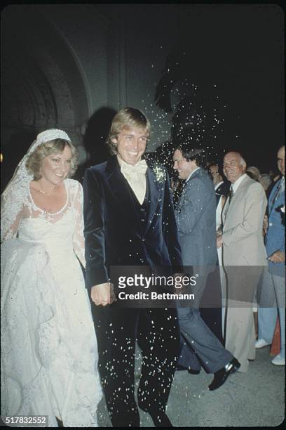 Ft. Lauderdale, Florida: Beaming newlyweds, Englishman John Lloyd and Chris Evert, are showered with rice as they leave St. Anthony's Church...