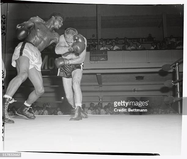 Floyd Patterson almost lost a left that threaded its way through the guard of Jacques Royer, French Middleweight, in the 6th round of their bout at...