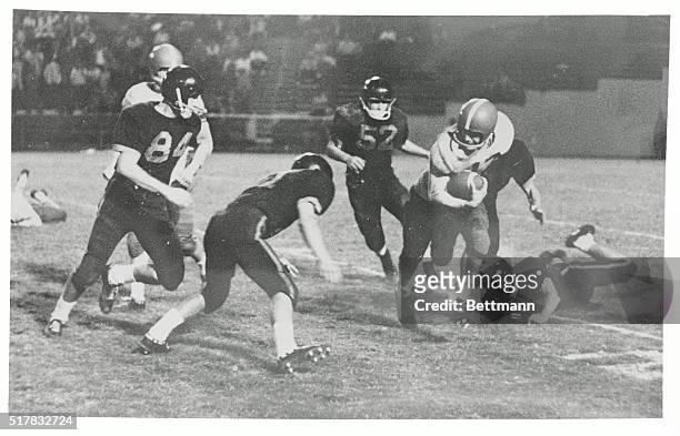 Miami, Florida: Nick Paone of Brockton, finds himself surrounded by the opposition as Miami High and Brockton battle it out during the second quarter...