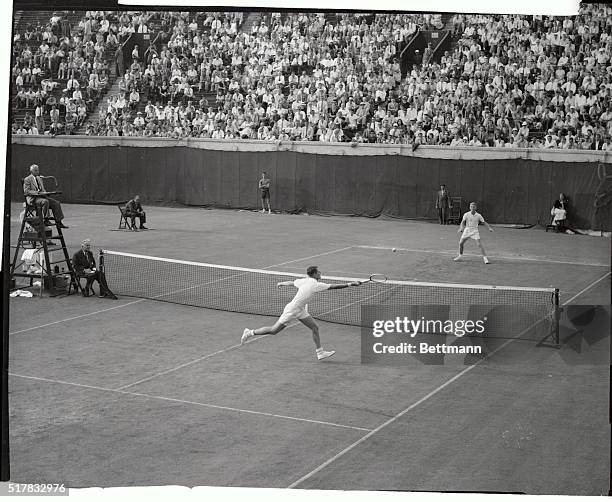 Ham Richardson is shown as he slammed a return to Lewis Hoad, of Australia, during their quarter final match in the National Tennis Championships...