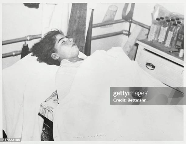 Emilie and Home Where She Died. Saint Agathe, Quebec: At left, above, peaceful in death, Emilie Dionne lies in the J.H. Vanier Funeral Home in Saint...