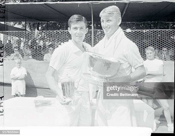 Lewis Hoad, of Australia holds the winner's trophy after defeating his Davis Cup teammate Ken Rosewall to retain the men's singles crown at the...