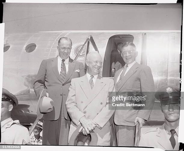 President Eisenhower is shown with Secretary of Agriculture, Ezra Taft Benson, , and Secretary of Interior, Douglas McKay, as they prepared to leave...