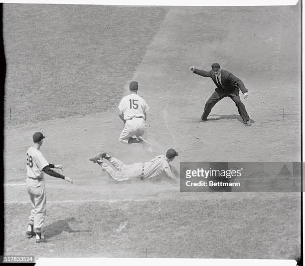Jim Rivera, rightfielder for the Chicago White Sox is out at first base on a great play by New York Yankee third baseman Andy Carey, who threw to...