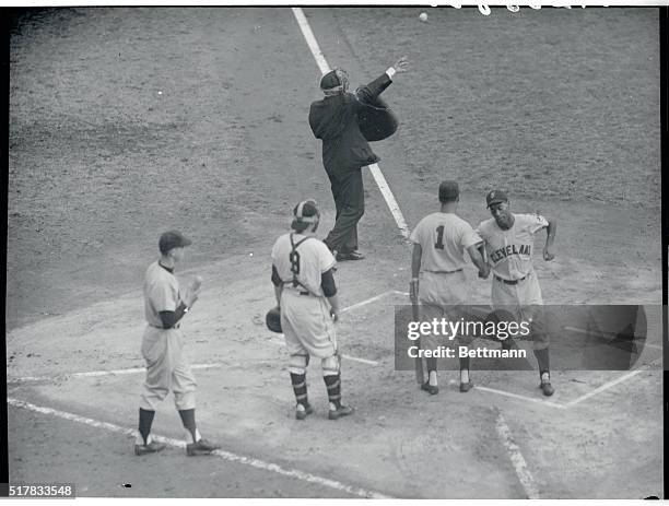 Cleveland's Al Smith is congratulated by Bobby Avila as he crosses the plate on his leadoff homer in the first inning of the second World Series game...