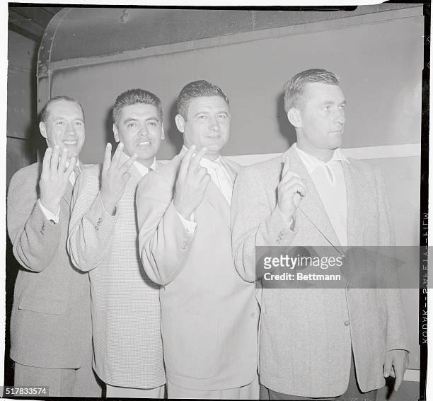 Draw your own conclusions as to the significant gesture of these four fire ballers of the Cleveland Indian pitching staff, on arrival at Grand...