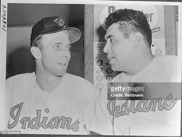 Catcher Jim Hegan and pitcher Mike Garcia of the Indians look each other over approvingly after the two combined their efforts to defeat the Boston...