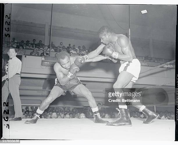 Brooklyn's Floyd Patterson slams Esau Ferdinand of San Francisco with a right in the sixth round of their 8 round light-heavyweight bout at St....